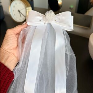 First Communion white satin bow and tulle veil with floral and crystal accent